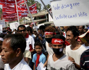 Thousands of Rakhine Buddhists protest against allowing white card holders to vote in the upcoming general elections, in Sittwe